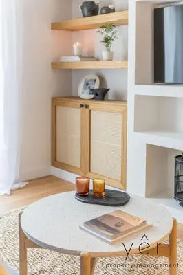 a living room with a table with two cups on it at Luxury Home & Great Location in Athens