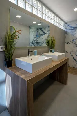 a bathroom with two sinks and a large mirror at Maxblue 2 in Piraeus