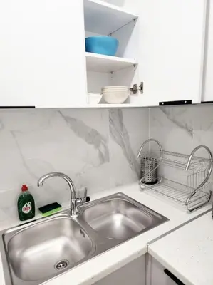 a kitchen with a sink and a counter top at Kipseli's Home VIPGreece in Athens