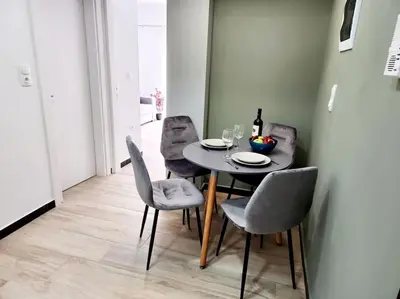 a dining room with a table and chairs at Kipseli's Home VIPGreece in Athens
