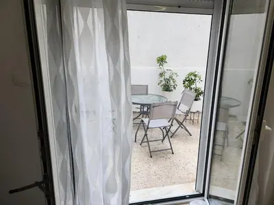a room with a window with a table and chairs at Kipseli's Home VIPGreece in Athens