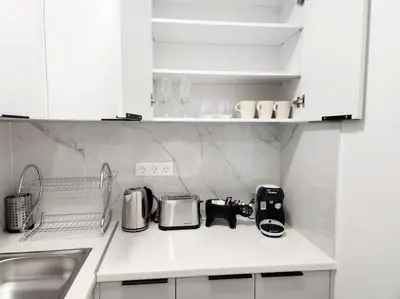a kitchen with a counter top with appliances on it at Kipseli's Home VIPGreece in Athens
