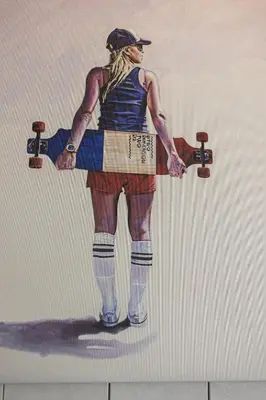 a painting of a man holding a skateboard at Triple A @ Trendy Psiri - Art & Nightlife in Athens