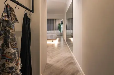 a hallway leading to a living room with a bed at Triple A @ Trendy Psiri - Art & Nightlife in Athens