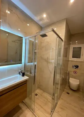 a bathroom with a shower and a sink at Pagrati-Luxury central cozy studio in Athens