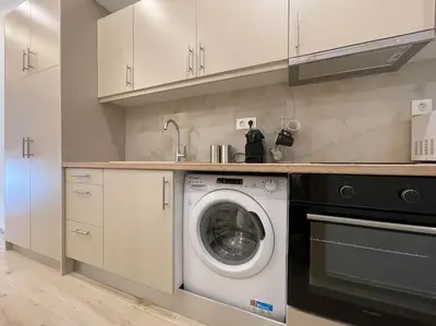 a kitchen with a washing machine and a sink at Pagrati-Luxury central cozy studio in Athens