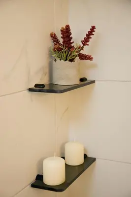two candles on a shelf with a potted plant at Aroura Homes 2BR Central Balcony Apt Metro in Athens