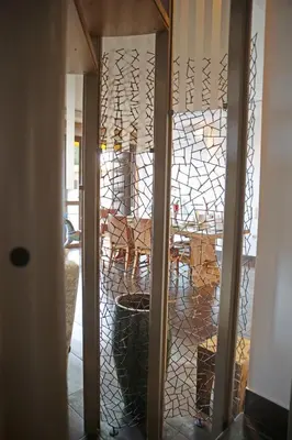 a view of a dining room through a glass door at Villa 47 in Keratea