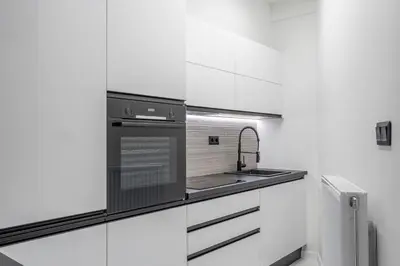 a kitchen with a sink and a stove at Luxury Studio Apartment in the Heart of Athens in Athens