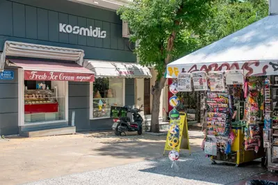 a store with a tent in front of a street at Luxury Studio Apartment in the Heart of Athens in Athens