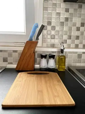 a cutting board and knife block on a kitchen counter at Skyline oasis rooftop in Athens