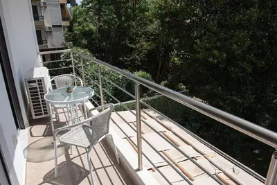 a patio with a table and chairs on a balcony at Bright 2BR apartment in Palaio Faliro-(FAL_A1) in Athens