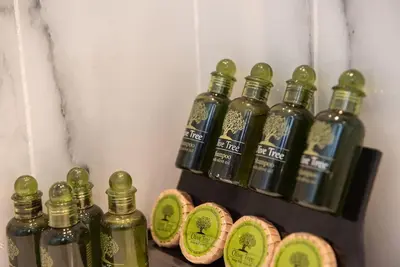 a group of bottles of alcohol on a shelf at Bright 2BR apartment in Palaio Faliro-(FAL_A1) in Athens