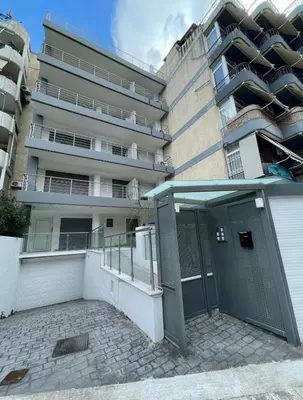a building with a door in front of it at Bright 2BR apartment in Palaio Faliro-(FAL_A1) in Athens