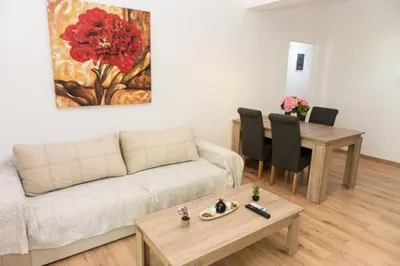 a living room with a couch and a table at Renovated spacious flat 7min to subway station-(ΝIK_A) in Athens