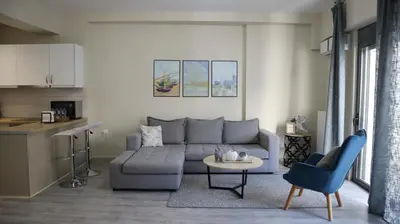 a living room with a couch and a table at Dafni City Apartment 1 in Athens