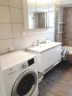 a bathroom with a washing machine and a sink at EcoStay-Scandy,2bdr cozy apartment by the sea in Alimos in Athens