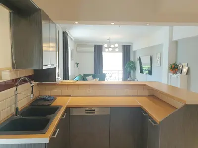 a kitchen with a sink and a counter top at EcoStay-Scandy,2bdr cozy apartment by the sea in Alimos in Athens