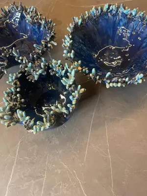 two blue vases with beads on them on a table at Sapfo Luxury Apartment 1 in Athens in Athens