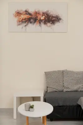 a living room with a couch and a table at Phos Apartment by A&D Properties in Porto Rafti