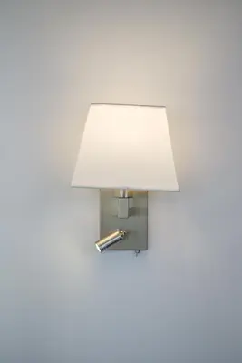 a light with a white shade on a wall at Glassy Apartment in Athens