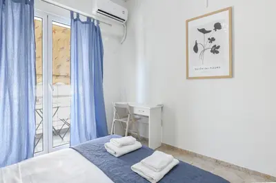 a bedroom with a bed and a desk and a window at Sweet & New Studio-Center Athens in Athens