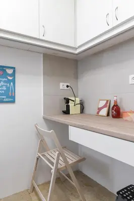 a wooden chair sitting on a counter in a kitchen at Sweet & New Studio-Center Athens in Athens