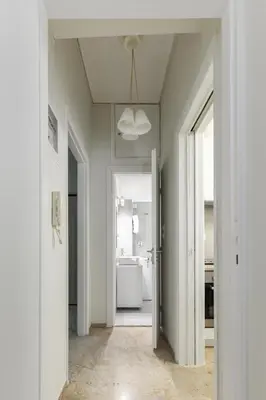 a hallway with a bathroom with a sink and a ceiling at Sweet & New Studio-Center Athens in Athens