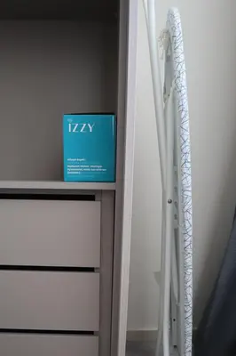 a blue box on a dresser in a room at Dafni City Apartment 2 in Athens