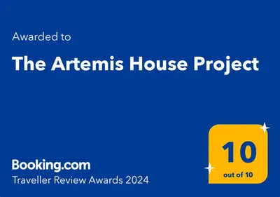 a yellow box with the text the athens house project at The Artemis House Project in Artemida