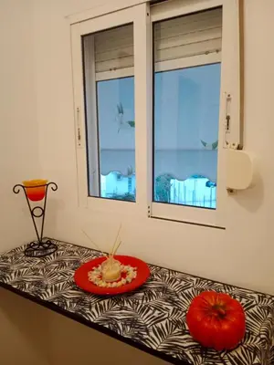 a table with a plate of food on top of it at Platinum Central Apartment in Athens