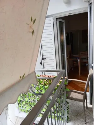 a staircase with a flower on the side of a house at Platinum Central Apartment in Athens