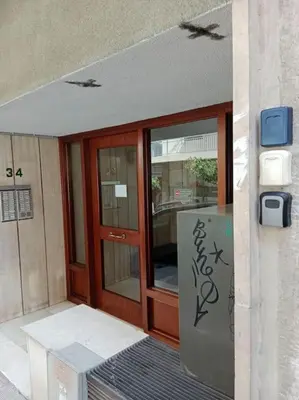 an entrance to a building with a glass door at Platinum Central Apartment in Athens