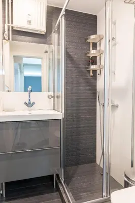 a bathroom with a sink and a shower at Kolonaki Comfort, Walk to Metro, Plaka & Syntagma in Athens