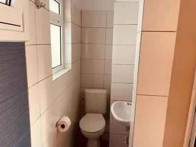 a small bathroom with a toilet and a sink at Athens Tiny rooftop by Super Host Hub in Athens