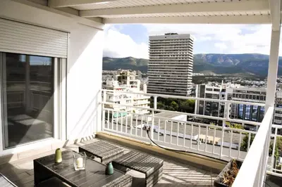 a balcony with a view of a city at Athens Tiny rooftop by Super Host Hub in Athens