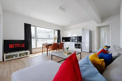 a living room with a couch and a table at Costa Alimos by Verde Apartments in Athens