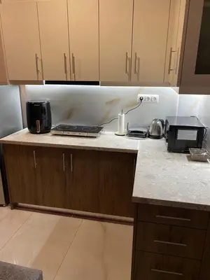 a kitchen with a counter top with a laptop on it at Modern Rous Apartment in Athens in Athens