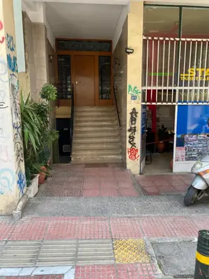 a building with stairs leading to a door at Modern Rous Apartment in Athens in Athens