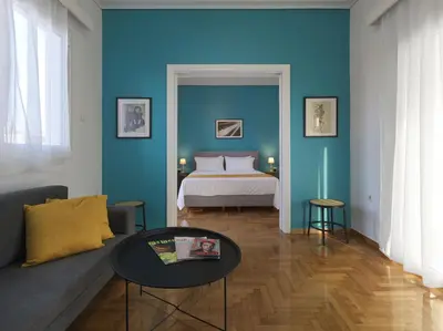 a living room with a bed and a couch at Acropolis View top floor apartment in Athens