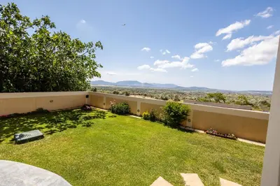 a view from the backyard of a house at Thea Apartment_Athens Airport in Spáta