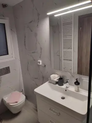 a bathroom with a sink and a toilet and a mirror at Acropolis Oasis by YHA in Athens