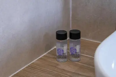 two bottles of water are sitting on the floor at Divine 2BR Apartment in the Heart of Athens in Athens