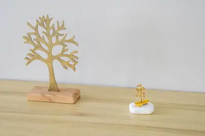 two miniature figurines of a tree on a table at Divine 2BR Apartment in the Heart of Athens in Athens