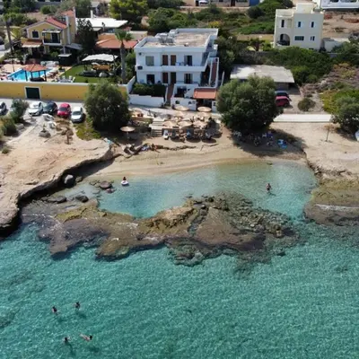 an aerial view of a beach with people in the water at Sylvia's house at Vagia in Vaia