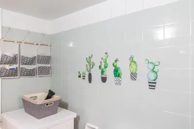 a bathroom with cacti on the wall at Sweet greek memories-Acropolis in Athens