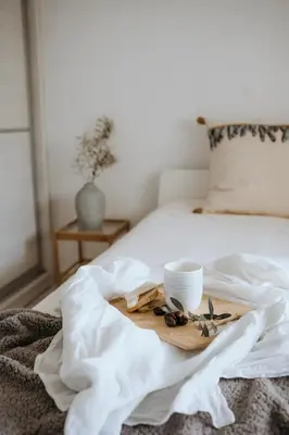 a wooden tray with a cup on a bed at Greek Sea Villas Kaki Thalassa 400m to the beach ,Athens in Keratea
