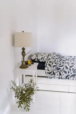 a bedroom with a bed and a table with a lamp at Greek Sea Villas Kaki Thalassa 400m to the beach ,Athens in Keratea