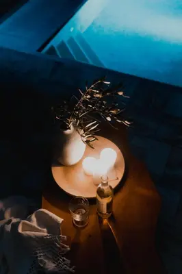 a table with a candle and a vase on it at Greek Sea Villas Kaki Thalassa 400m to the beach ,Athens in Keratea