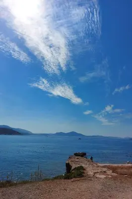 a view of a body of water with a cloudy sky at Naiads Nest - The Blue Wave in Varkiza